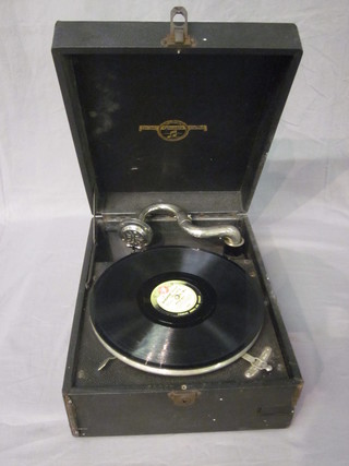 A portable manual gramophone contained in a fibre case