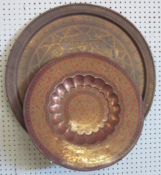 A circular benares brass tray 23 1/2" and 1 other 17"
