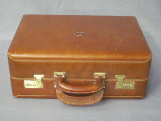 A brown leather brief case