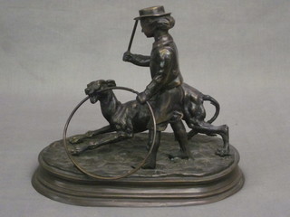 A bronze figure of a child with hoop and dog 9"
