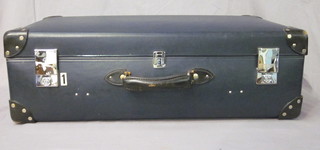A blue Globe Trotter suitcase