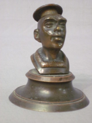 A bronze head and shoulders portrait bust of a Chinaman raised  on a circular case 3"