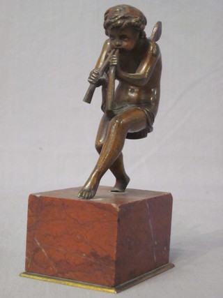 A 19th Century bronze figure of faun raised on a red marble  base 6"  ILLUSTRATED