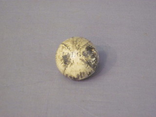 A small leather ball marked Jalga 1"