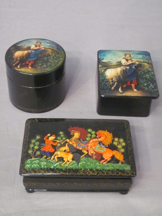 A Russian lacquered trinket box with hinged lid decorated a mythical scene 5", 1 other decorated a lady and a cylindrical  trinket box 3"