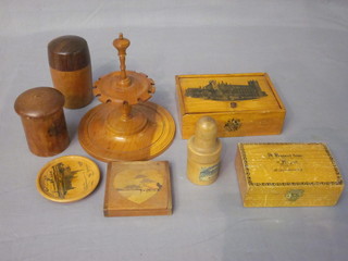 A turned yew office stamp holder, a treen box decorated Westminster Abbey and various other items of treen