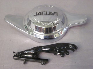 A black metal Jaguar car mascot 5" and a chrome Jaguar wheel  hub