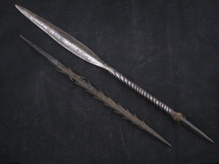 A steel spear with 8" blade and 1 other spear with barbed blade  11"