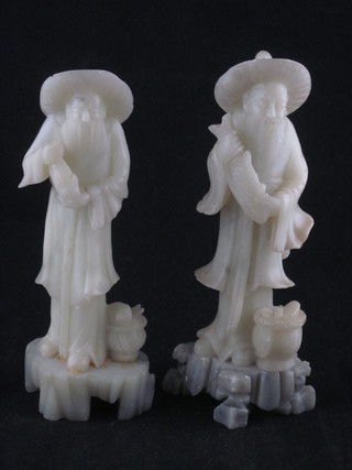 A pair of Oriental soapstone figures of standing fisherman 7"