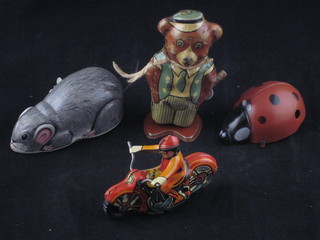 A British tin plate clockwork figure of a walking bear, a tin plate  motor cyclist, mouse and 1 other toy