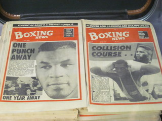 A suitcase containing approx. 200 editions of Boxing News
