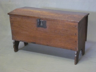 A 17th/18th Century elm coffer of small proportions and panelled construction 31"