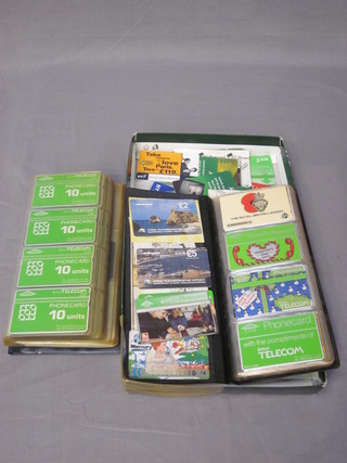 2 albums of various phone cards together with a collection of various phone cards
