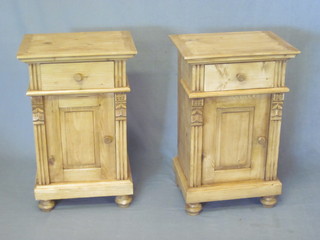 A pair of Continental stripped and polished pine bedside cabinets fitted a drawer above a cupboard 18"