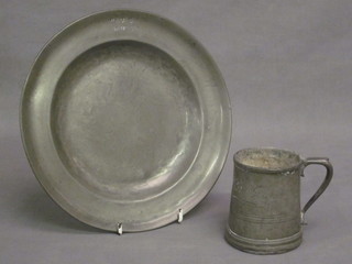 A circular pewter plate 9", the base with touch mark and a  pewter tankard