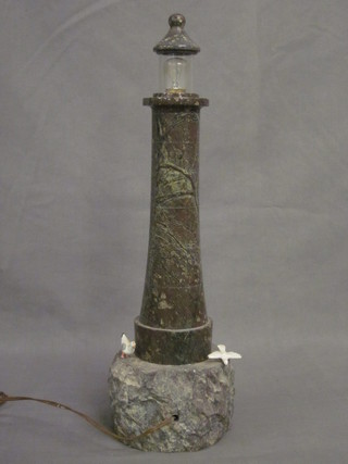 A serpentine table lamp in the form of a light house 18"