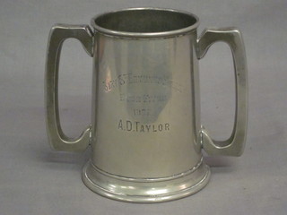 A pewter twin handled loving cup marked Bury St Edmonds  School Eaton Fives 1902 D A Taylor