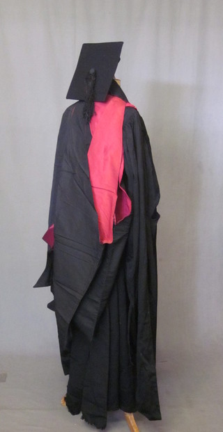 A black Academic gown, mortar board, 3 hoods and a black stole