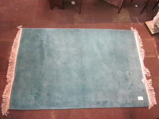 A turquoise ground Chinese rug 110" x 74 1/2"