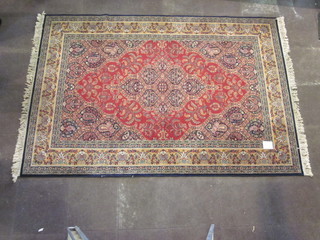 A red ground Persian style rug 116" x 78"