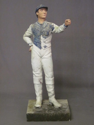 A concrete figure of a standing jockey 42"   ILLUSTRATED