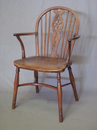 An 18th/19th Century elm and yew Windsor wheel back kitchen  carver chair with cow horn stretcher  ILLUSTRATED