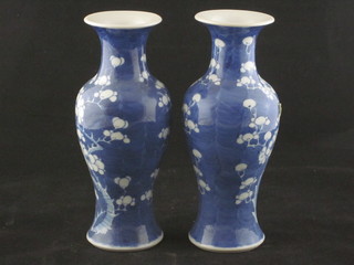 A pair of Oriental blue and white club shaped porcelain vases 7"