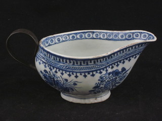An Oriental blue porcelain sauce boat with iron handle 6"