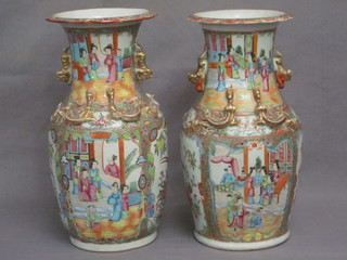 A pair of 19th Century Canton famille rose porcelain vases of  club form, decorated court figures, 14"  ILLUSTRATED FRONT COVER