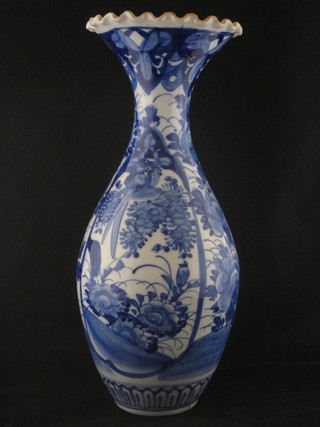 An Oriental blue and white club shaped vase 15"