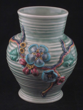 A circular Clarice Cliff turquoise glazed vase, the base marked  912 Clarice Cliff, 7"