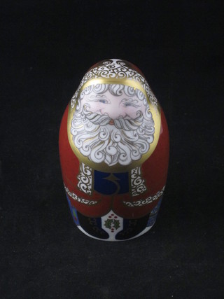 A Royal Crown Derby porcelain figure of a seated Father Christmas, base marked LXI