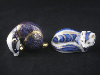 A Royal Crown Derby porcelain figure of a seated fox, base  marked LVM together with 1 other of a Badger base marked  LXI, both seconds
