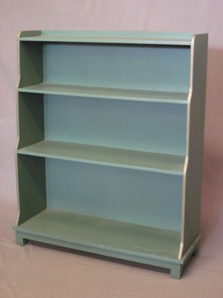 A pair of green painted 4 tier waterfall bookcases, raised on square supports 30"