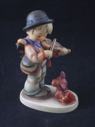 A Goebel figure of a standing boy with violin and seated dog 5"