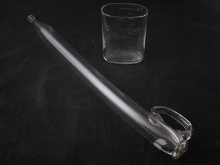 A glass Toddy lifter 17" and an oval Continental etched glass  measure 4 1/2"