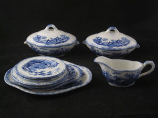A childs 10 piece 19th Century blue and white pottery dinner  service comprising 2 oval tureens 5" - 1 with cracked lid, 3  graduated oval meat plates 7", 6" and 5", 2 dinner plates 4 1/2",  2 tea plates 4" - 1 chipped and a sauce boat
