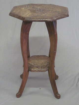 An Eastern octagonal carved hardwood 2 tier occasional table, raised on cabriole supports 17"