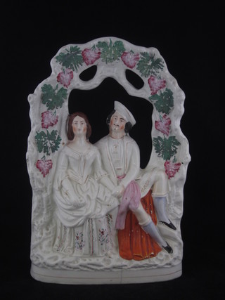 A 19th Century Staffordshire flat back arbour figure of a seated  Scotsman and Lady 13", cracked,
