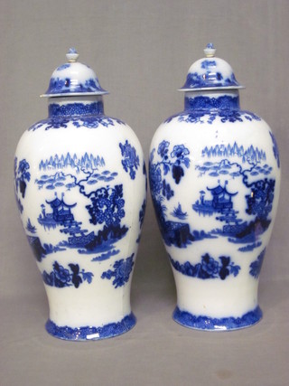 A pair of Oriental style blue and white vases 19", f,