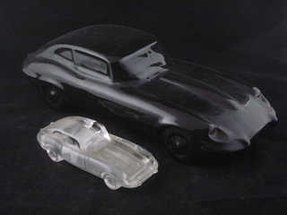 A black glazed model Jaguar motorcar 14" and a glass sculpture  of a Jaguar
