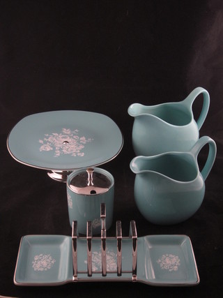A collection of Mid Winter Stylecraft ware in turquoise  comprising toast rack, 2 graduated jugs, preserve jar and cover  and a tazza