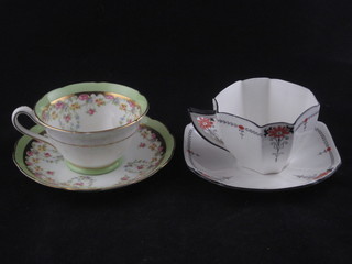 A 21 piece Shelley tea service comprising twin handled plate 8",  7 tea plates 6 1/2", 7 saucers, 6 cups, the base marked 11497 RD  no. 723404 together with an 18 piece Jackson & Gosli tea  service comprising 6 tea plates 6", 5 cups and 5 saucers - 4  cracked and a cream jug