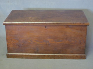 An elm trunk with hinged lid and iron drop handles 33"