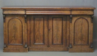 A Victorian walnut sideboard fitted 1 long drawer above a double cupboard flanked by a pair of arched panelled cupboards 74"   ILLUSTRATED
