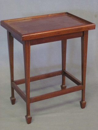 A rectangular mahogany occasional table raise on a square  tapering supports ending in spade feet 20"