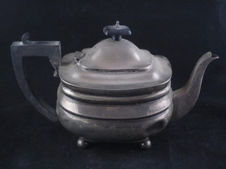 An oval Georgian style silver teapot London 1915 raised on bun  feet 17 ozs  ILLUSTRATED