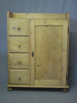 A Continental stripped and polished pine combination cabinet with three-quarter gallery fitted 4 short drawers flanked by a  cupboard 36"