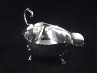 A silver sauce boat with C scroll handle, Birmingham 1935 2 ozs