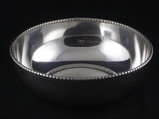 A circular Continental silver bowl with bead work border,  marked 925, 9 ozs